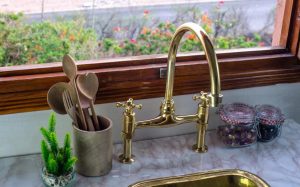 2023 The Timeless Elegance of Brass Bridge Kitchen Faucets - Blog - 1